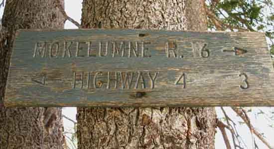 Mileage sign posted on top of Mount Reba.